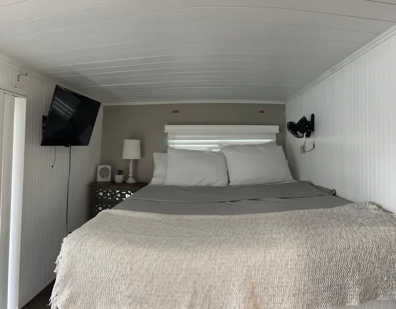 Slide: The Image of Cozy bedroom in 2004 Majestic houseboat with TV and modern decor. - 7