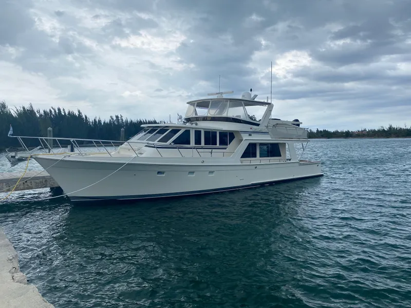 Slide: The Image of 2000 Offshore Yachts 62 Pilot House moored on a cloudy day. - 10