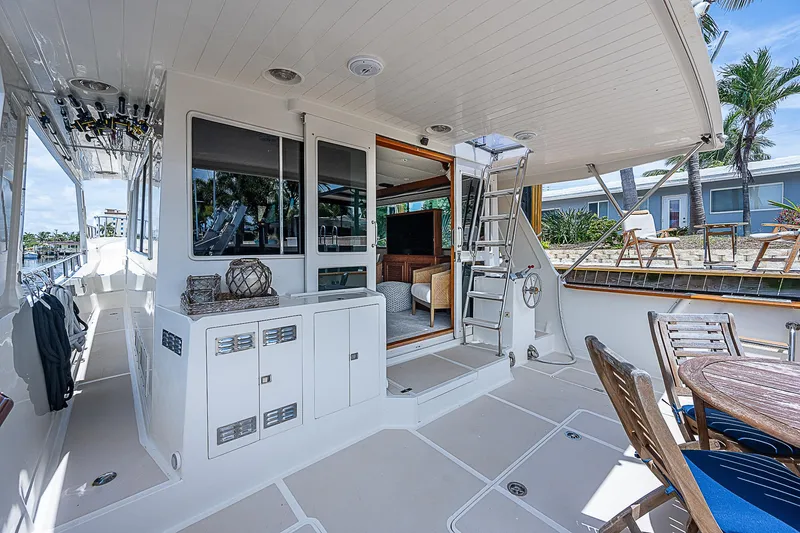 Slide: The Image of Spacious deck of 2000 Offshore Yachts 62 Pilot House with outdoor seating. - 18