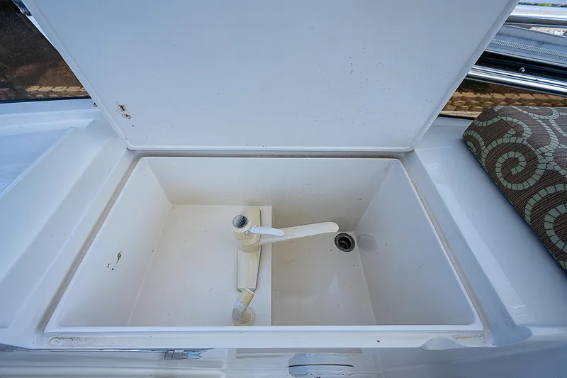 Slide: The Image of Open storage compartment on 2000 Offshore Yachts 62 Pilot House. - 32