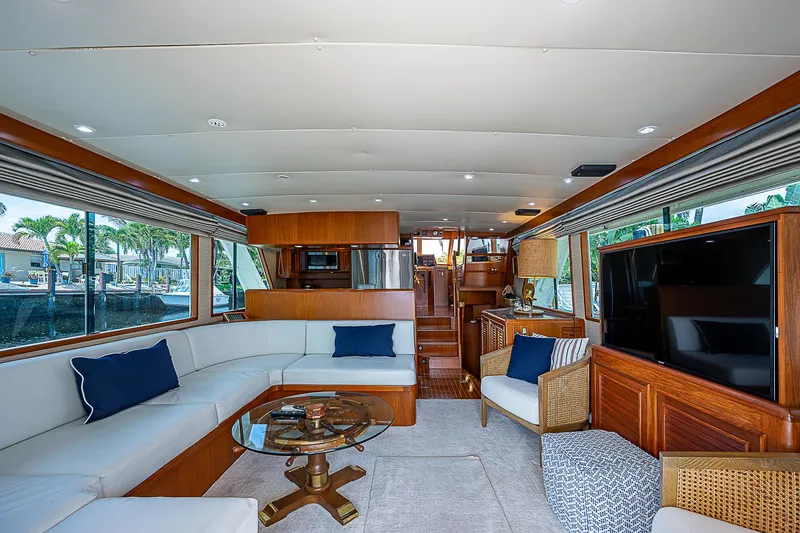Slide: The Image of Luxurious interior of 2000 Offshore Yachts 62 Pilot House with elegant seating and modern amenities. - 36