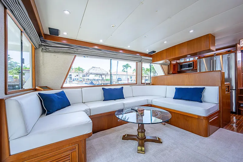Slide: The Image of Luxurious interior of 2000 Offshore Yachts 62 Pilot House with white seating and blue cushions. - 37