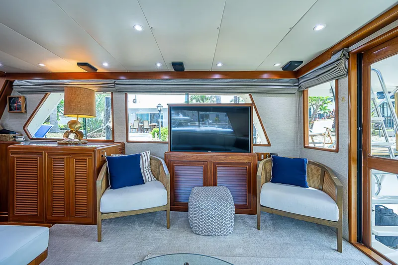 Slide: The Image of Luxurious interior of 2000 Offshore Yachts 62 Pilot House with elegant seating and decor. - 39