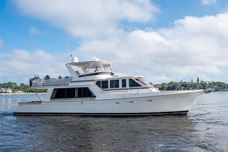 Slide: The Image of 2000 Offshore Yachts 62 Pilot House cruising on a sunny day. - 4