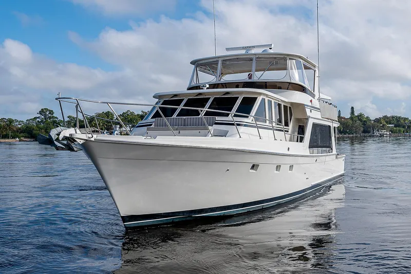 Slide: The Image of 2000 Offshore Yachts 62 Pilot House cruising on calm waters. - 5