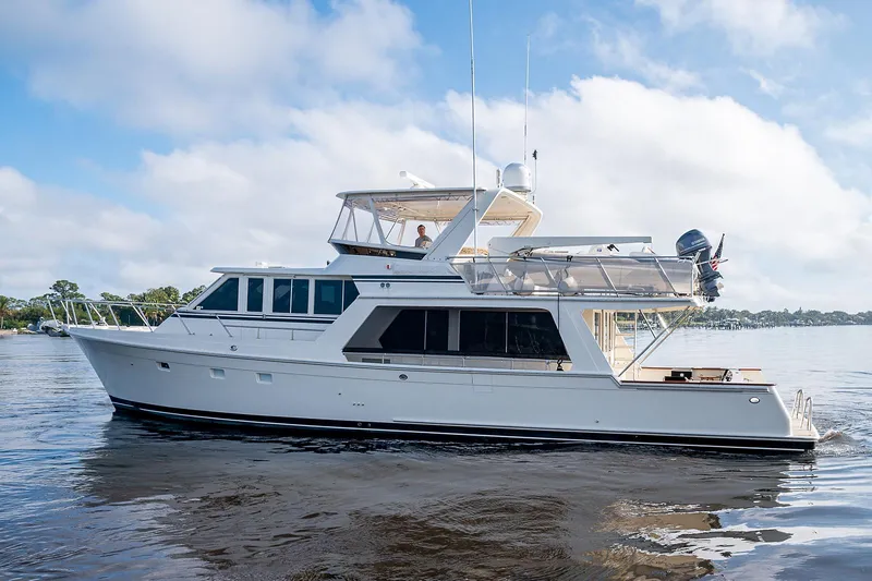 Slide: The Image of 2000 Offshore Yachts 62 Pilot House cruising on calm waters. - 6