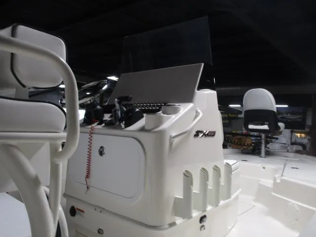 Slide: The Image of 2025 Skeeter SX221 boat interior with steering console and seating. - 3