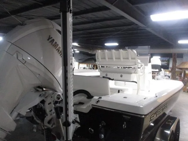 Slide: The Image of 2025 Skeeter SX221 boat with Yamaha engine in a warehouse setting. - 5