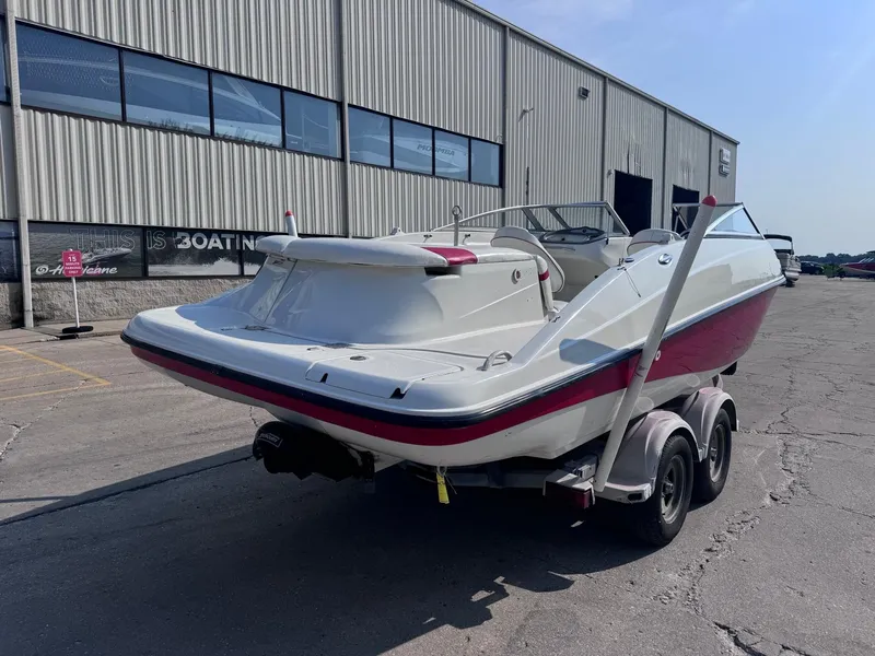 Slide: The Image of 2006 Sugar Sand Oasis boat on trailer outside a warehouse. - 5