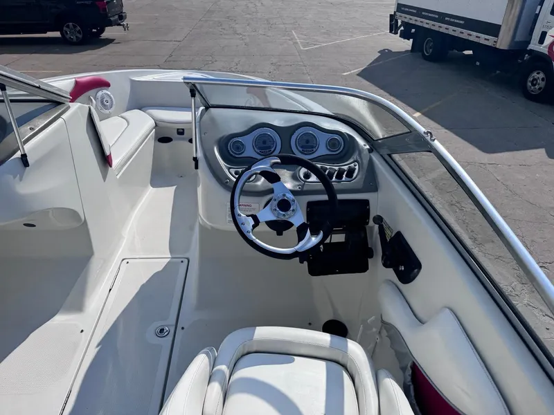 Slide: The Image of 2006 Sugar Sand Oasis boat interior with steering wheel and dashboard controls. - 8