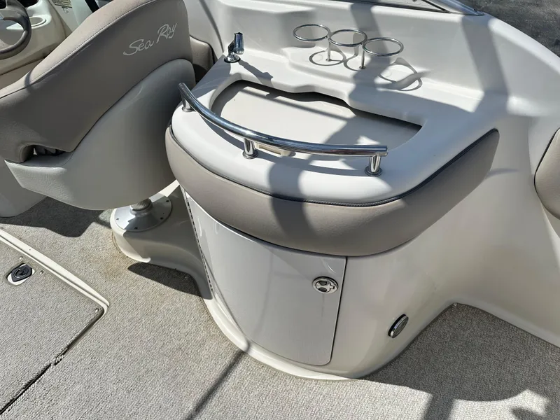 Slide: The Image of 2002 Sea Ray 270 SSI boat interior with cup holders and seating. - 7