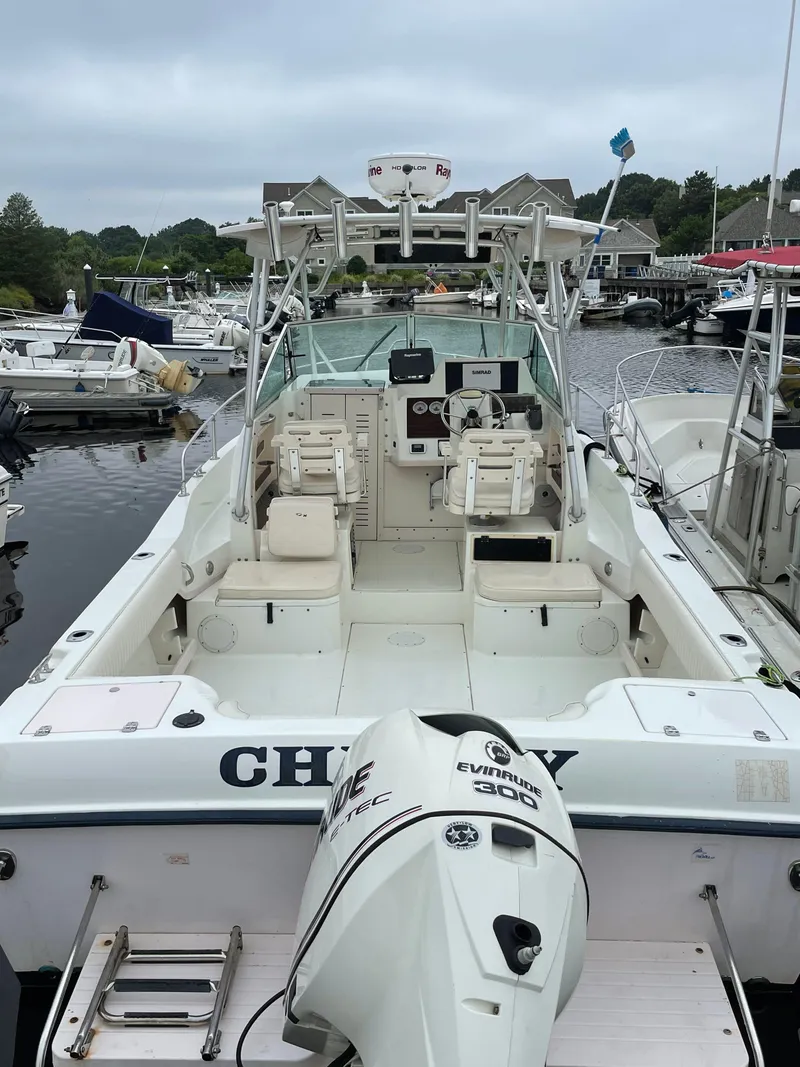 Slide: The Image of 2000 Grady-White 232 Gulfstream WA boat docked in marina, rear view. - 11