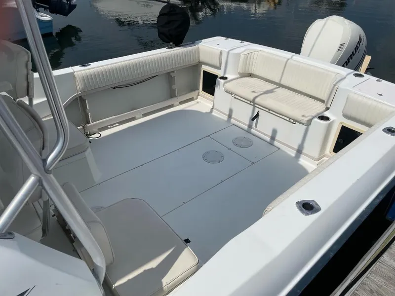 Slide: The Image of 2000 Grady-White 232 Gulfstream WA boat interior with seating and clean deck. - 13