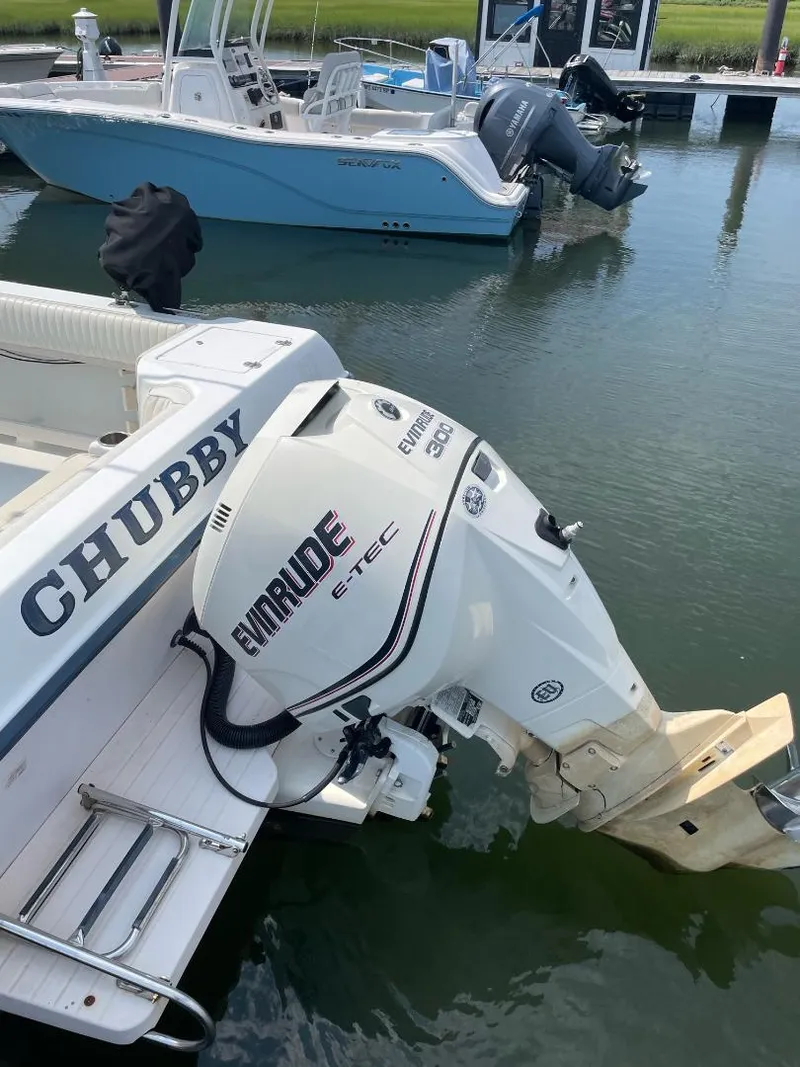 Slide: The Image of 2000 Grady-White 232 Gulfstream WA boat with Evinrude E-TEC engine at dock. - 20