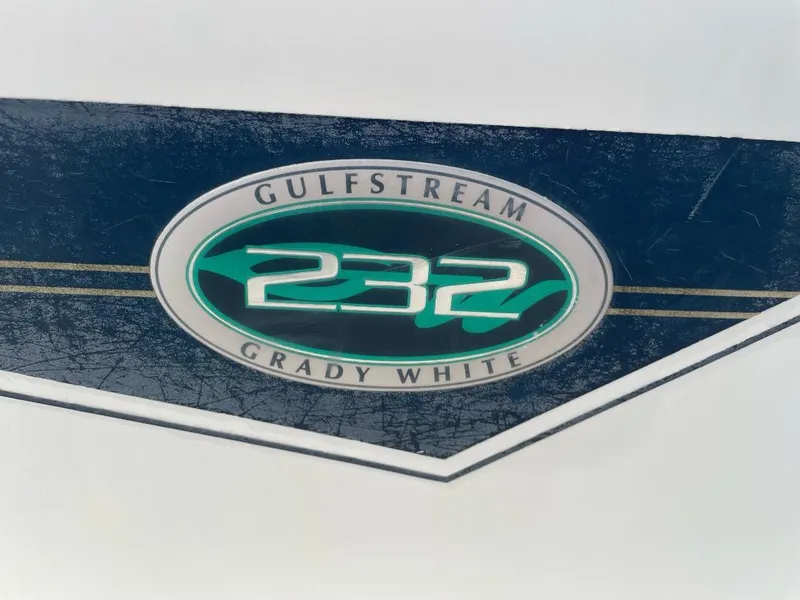 Slide: The Image of Grady-White 232 Gulfstream WA 2000 logo on a textured blue background. - 22