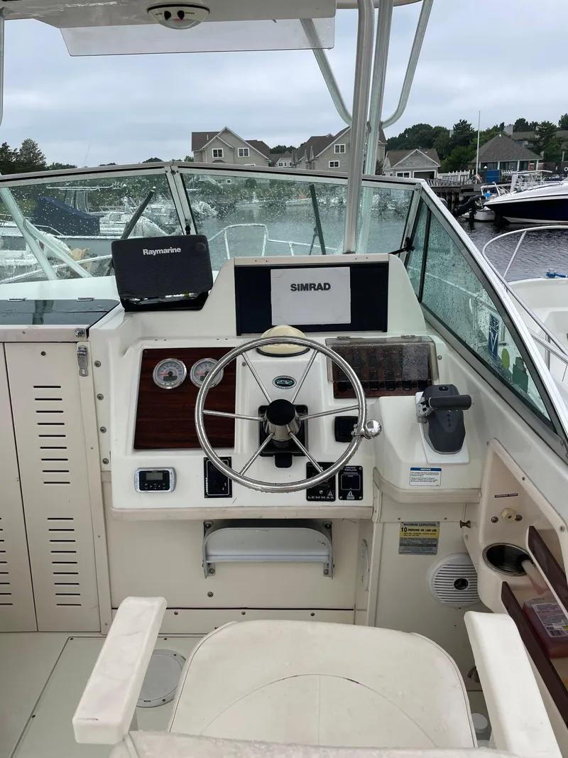 Slide: The Image of 2000 Grady-White 232 Gulfstream WA boat helm with navigation equipment. - 8