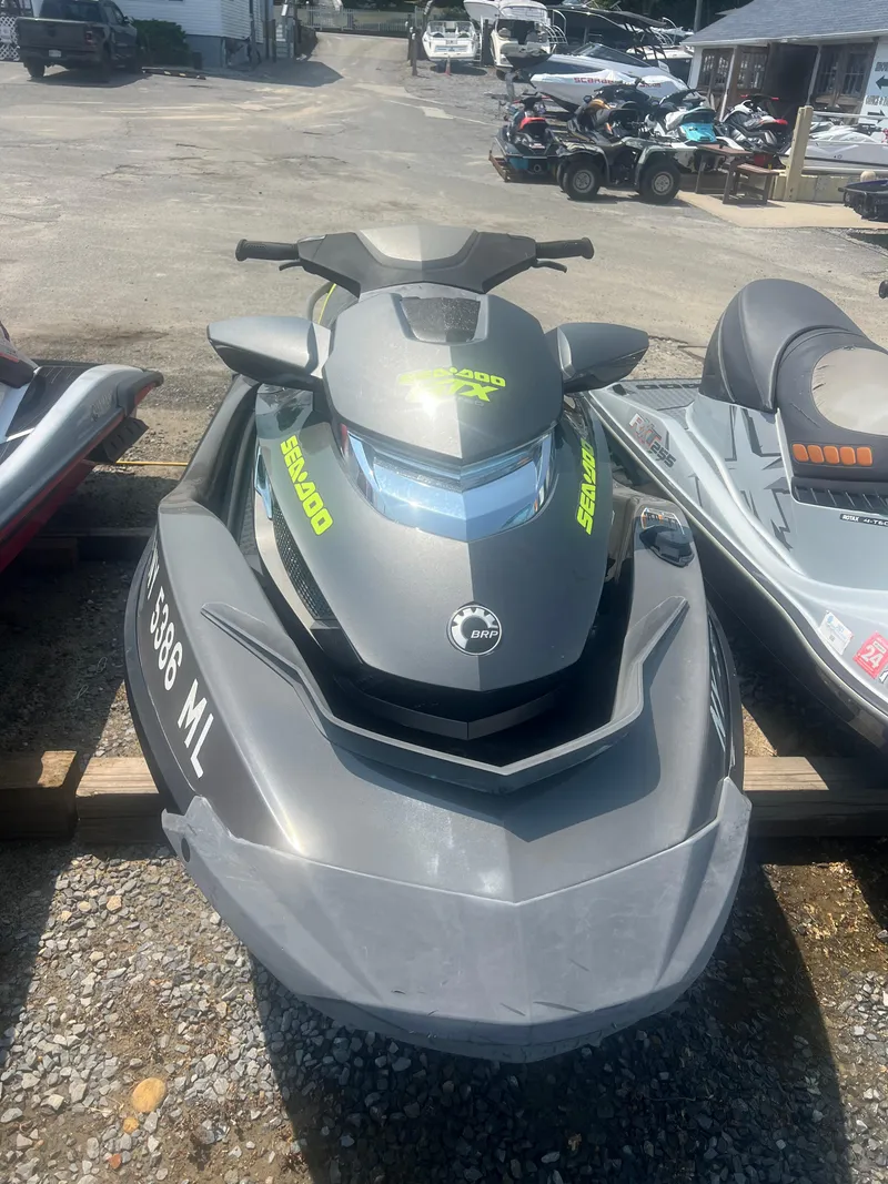 Slide: The Image of 2015 Sea-Doo GTX Limited iS 260 jet ski in a parking area. - 3