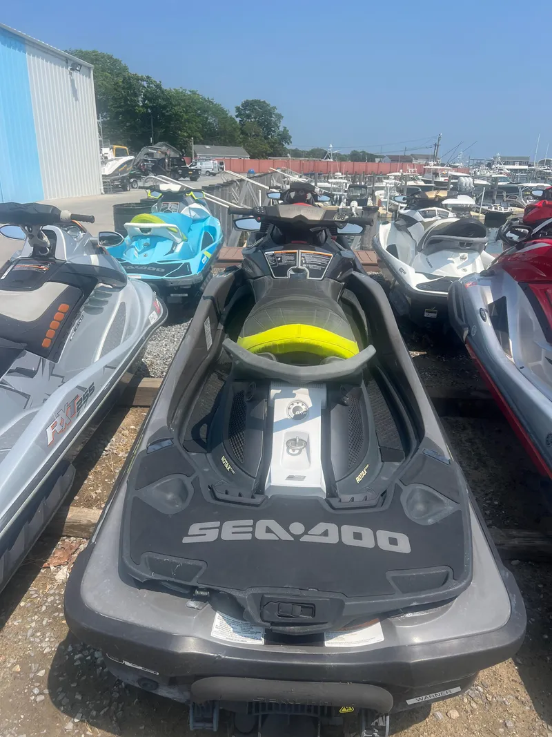 Slide: The Image of 2015 Sea-Doo GTX Limited iS 260 jet ski in a marina storage area. - 4