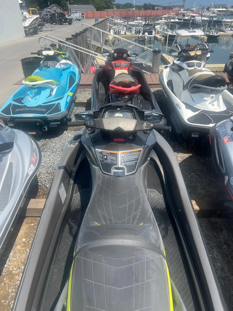 Slide: The Image of 2015 Sea-Doo GTX Limited iS 260 jet ski parked at marina. - 5