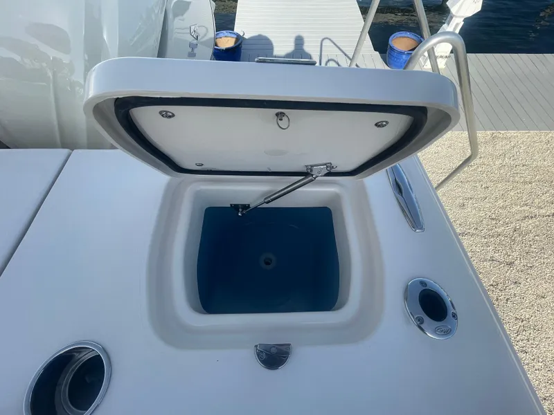 Slide: The Image of Open storage compartment on 2025 Grady-White Canyon 326 boat deck. - 14
