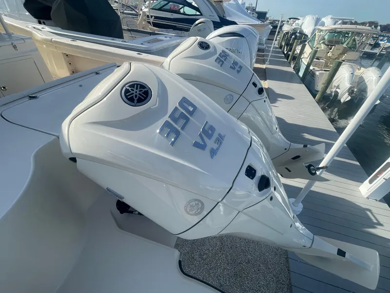 Slide: The Image of 2025 Grady-White Canyon 326 with Yamaha 300 V6 outboard engines at dock. - 16