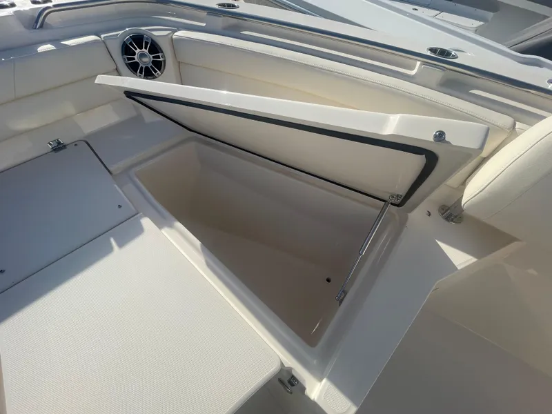 Slide: The Image of 2025 Grady-White Canyon 326 boat storage compartment with open lid. - 5