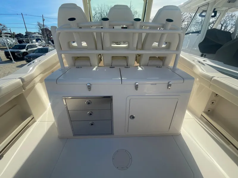 Slide: The Image of 2025 Grady-White Canyon 326 boat interior with seating and storage compartments. - 9