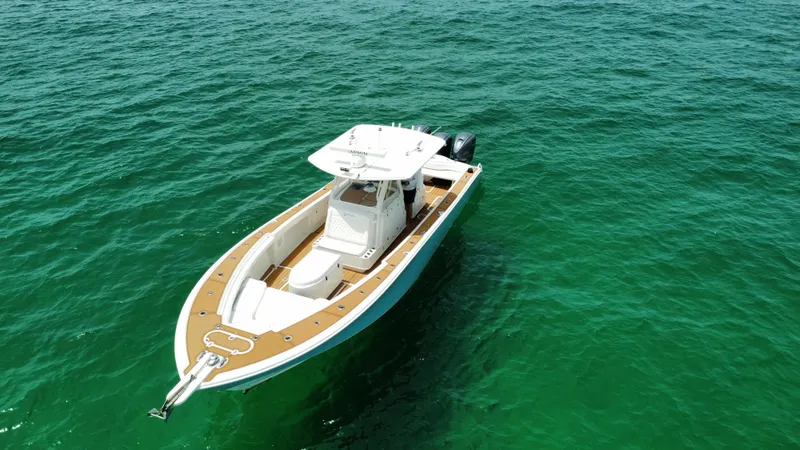 Slide: The Image of 2012 Yellowfin 39 Open boat on clear green water. - 10