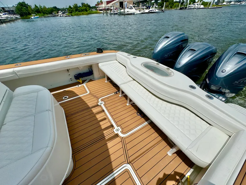 Slide: The Image of 2012 Yellowfin 39 Open boat with spacious seating and triple outboard engines. - 15