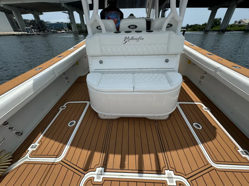 Slide: The Image of 2012 Yellowfin 39 Open boat interior with teak flooring and cushioned seating. - 16