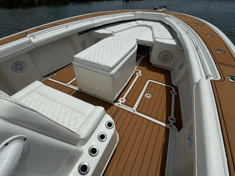 Slide: The Image of 2012 Yellowfin 39 Open boat with white seating and teak flooring. - 22