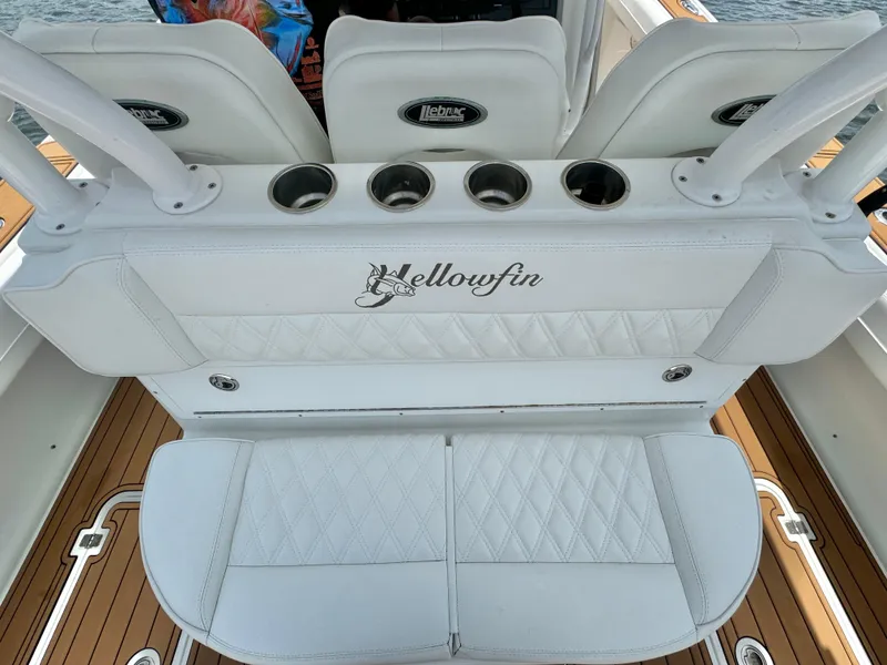 Slide: The Image of 2012 Yellowfin 39 Open boat seating with cup holders and elegant white upholstery. - 23