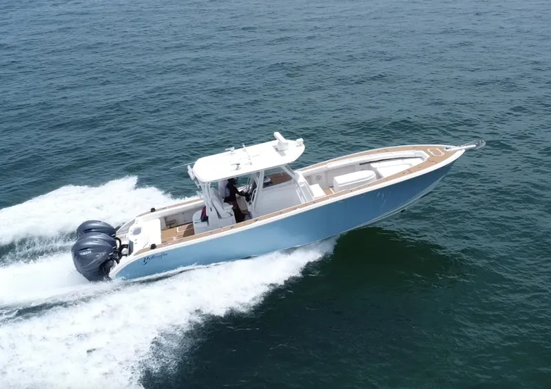 Slide: The Image of 2012 Yellowfin 39 Open boat cruising on the ocean. - 4