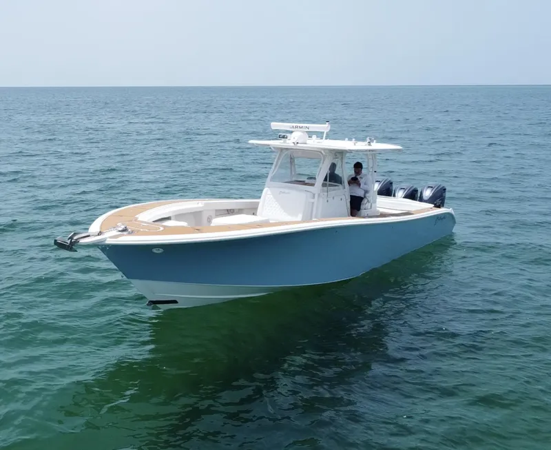 Slide: The Image of 2012 Yellowfin 39 Open boat on calm ocean waters. - 8