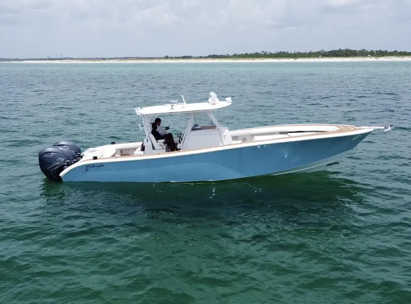 Slide: The Image of 2012 Yellowfin 39 Open boat on calm ocean waters. - 9