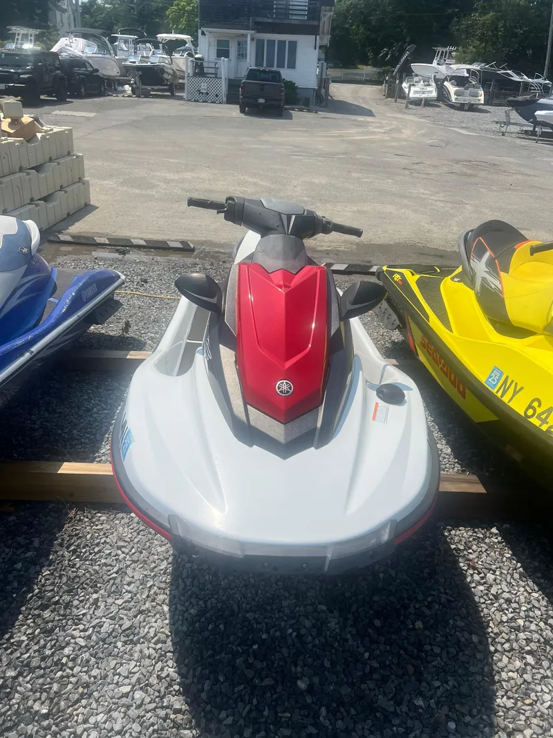 Slide: The Image of 2018 Yamaha WaveRunner EX Sport, red and white, parked on gravel lot. - 3