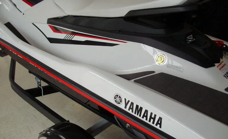 Slide: The Image of 2018 Yamaha WaveRunner EX Sport, white with red and black accents, on a trailer. - 6