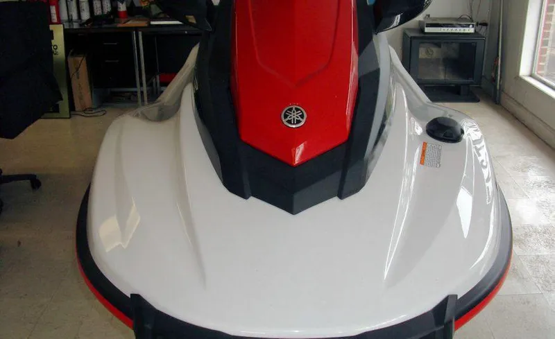 Slide: The Image of 2018 Yamaha WaveRunner EX Sport, red and white, front view in showroom. - 7