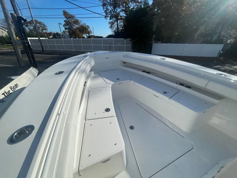 Slide: The Image of 2025 Regulator 28 boat with spacious seating and storage compartments. - 14