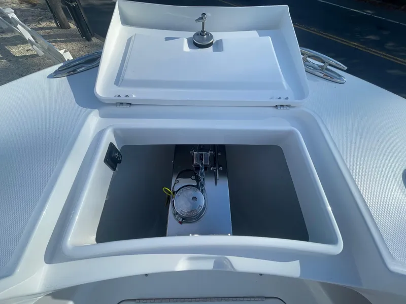 Slide: The Image of Open storage compartment on 2025 Regulator 28 boat deck. - 21