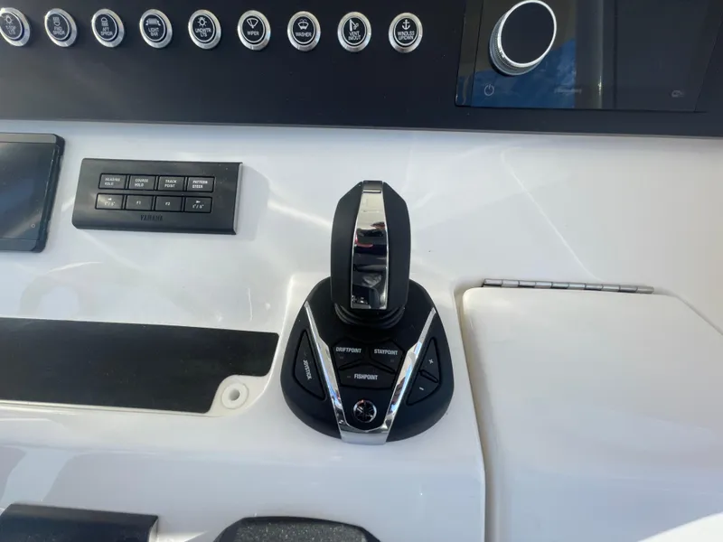 Slide: The Image of Regulator 28 boat control panel, 2025 model, featuring joystick and buttons. - 30