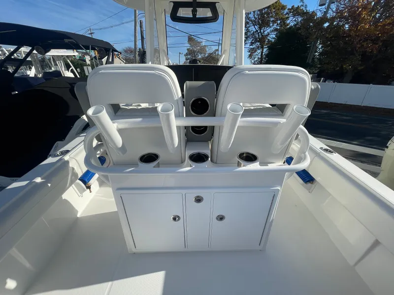 Slide: The Image of 2025 Regulator 28 boat interior with rod holders and storage compartments. - 35