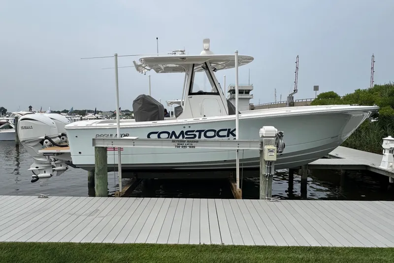 Slide: The Image of 2025 Regulator 28 boat docked, featuring Yamaha engines and Comstock branding. - 4