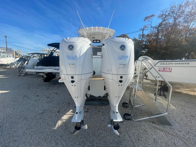 Slide: The Image of 2025 Regulator 28 boat with twin Yamaha outboard engines, displayed outdoors. - 46