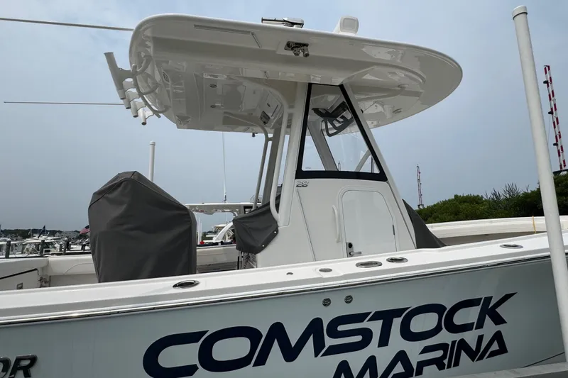 Slide: The Image of 2025 Regulator 28 boat at Comstock Marina, featuring sleek design and modern equipment. - 6