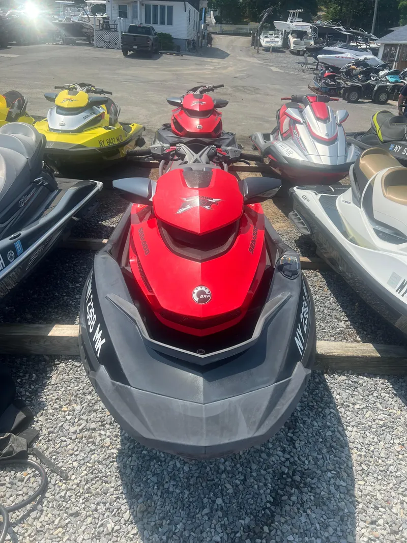 Slide: The Image of 2014 Sea-Doo RXT-X aS 260 jet ski in a row of watercrafts. - 3