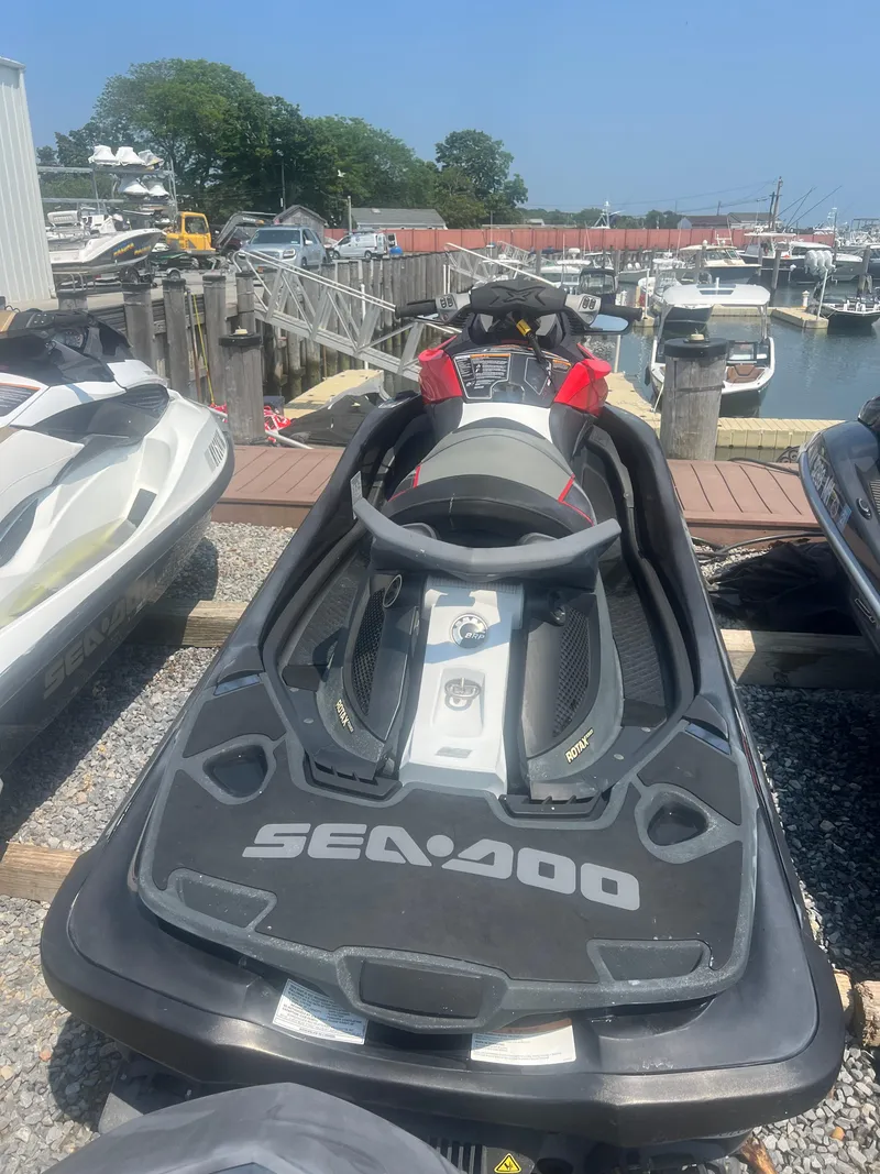 Slide: The Image of 2014 Sea-Doo RXT-X aS 260 jet ski at marina dock. - 5