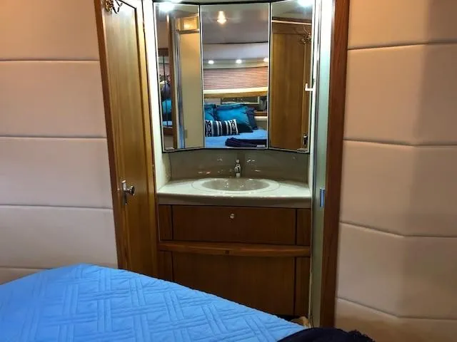 Slide: The Image of Bayliner 4087 Aft Cabin Motoryacht 2000 interior with vanity and mirror. - 16