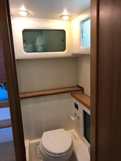 Slide: The Image of 2000 Bayliner 4087 Aft Cabin Motoryacht bathroom with modern fixtures and wood accents. - 19
