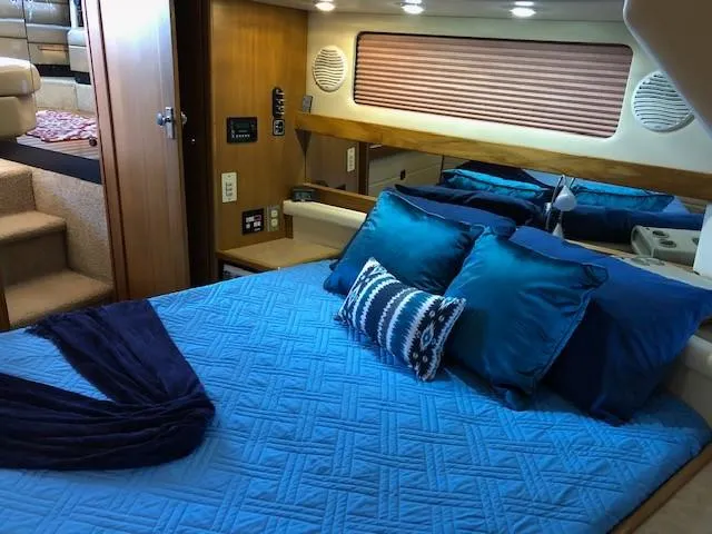 Slide: The Image of Luxurious cabin interior of 2000 Bayliner 4087 Aft Cabin Motoryacht with blue bedding. - 23